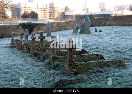 A row of graves in St. Andrew`s churchyard, Toddington, Gloucestershire, England, UK Stock Photo
